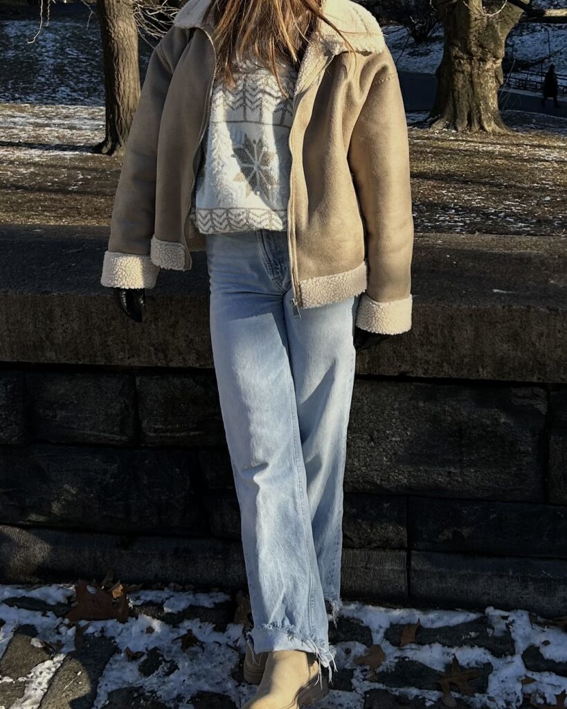 Cute winter outfit with layered sweater and button down, dark jeans, and sneakers. Cozy and aesthetic winter look for everyday wear.